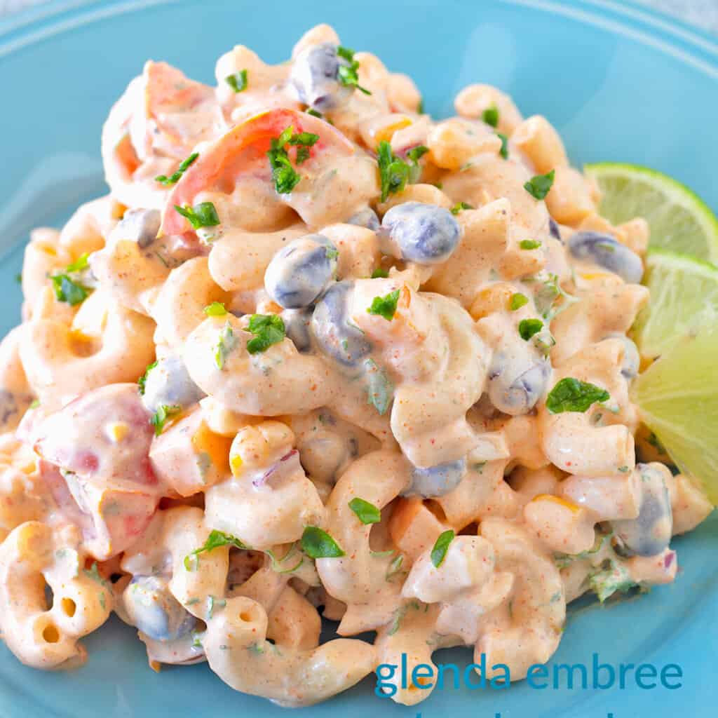 Mexican Macaroni Salad on a blue stoneware plate.