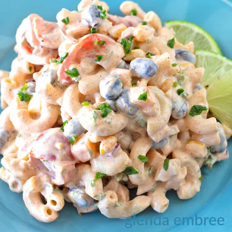 Mexican Macaroni Salad on a blue stoneware plate.