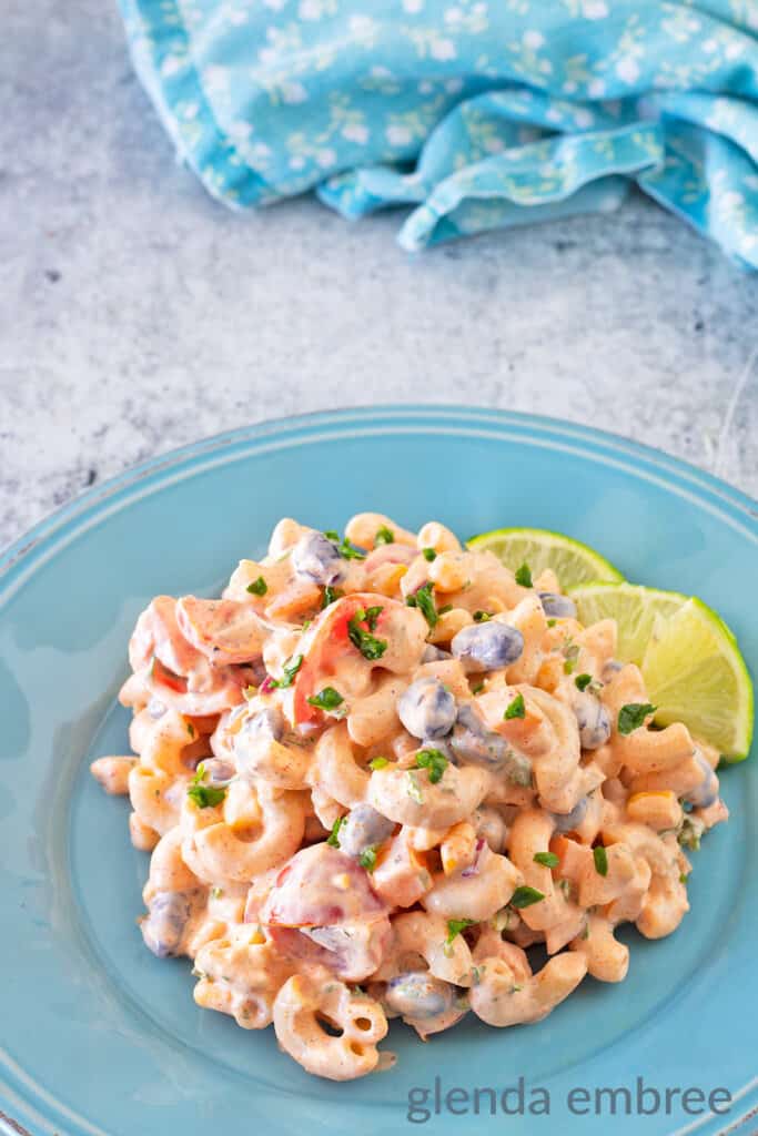 Mexican Macaroni Salad on a blue stoneware plate.