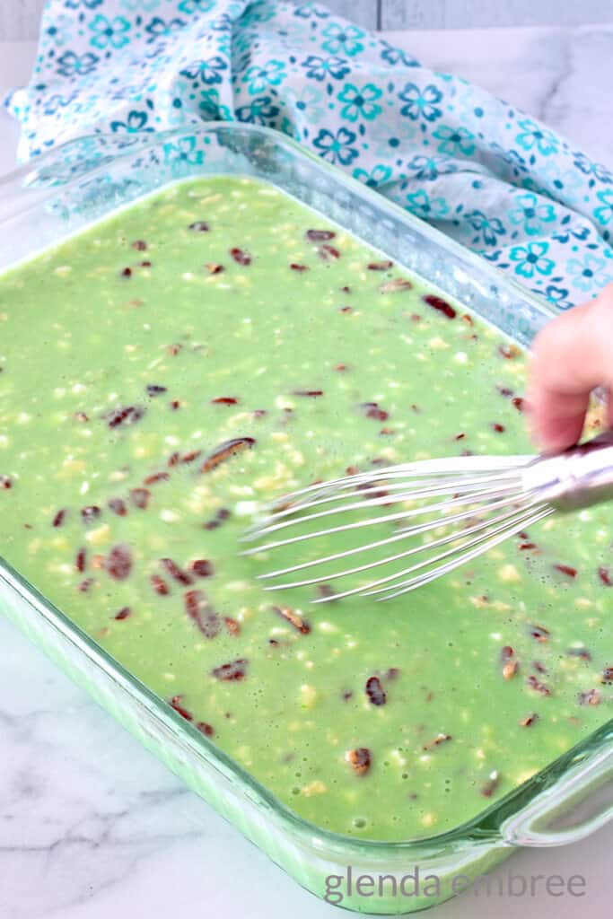 Lime Jello Salad with Cottage Cheese in a baking dish.