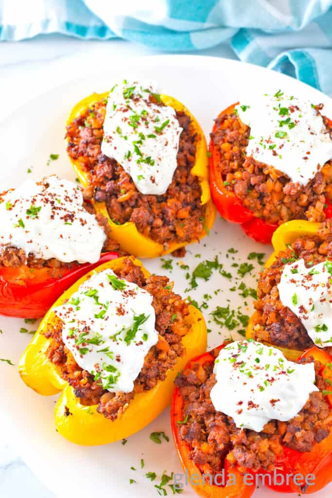 Air Fryer Stuffed Peppers with Curried Ground Lamb on a white plate.
