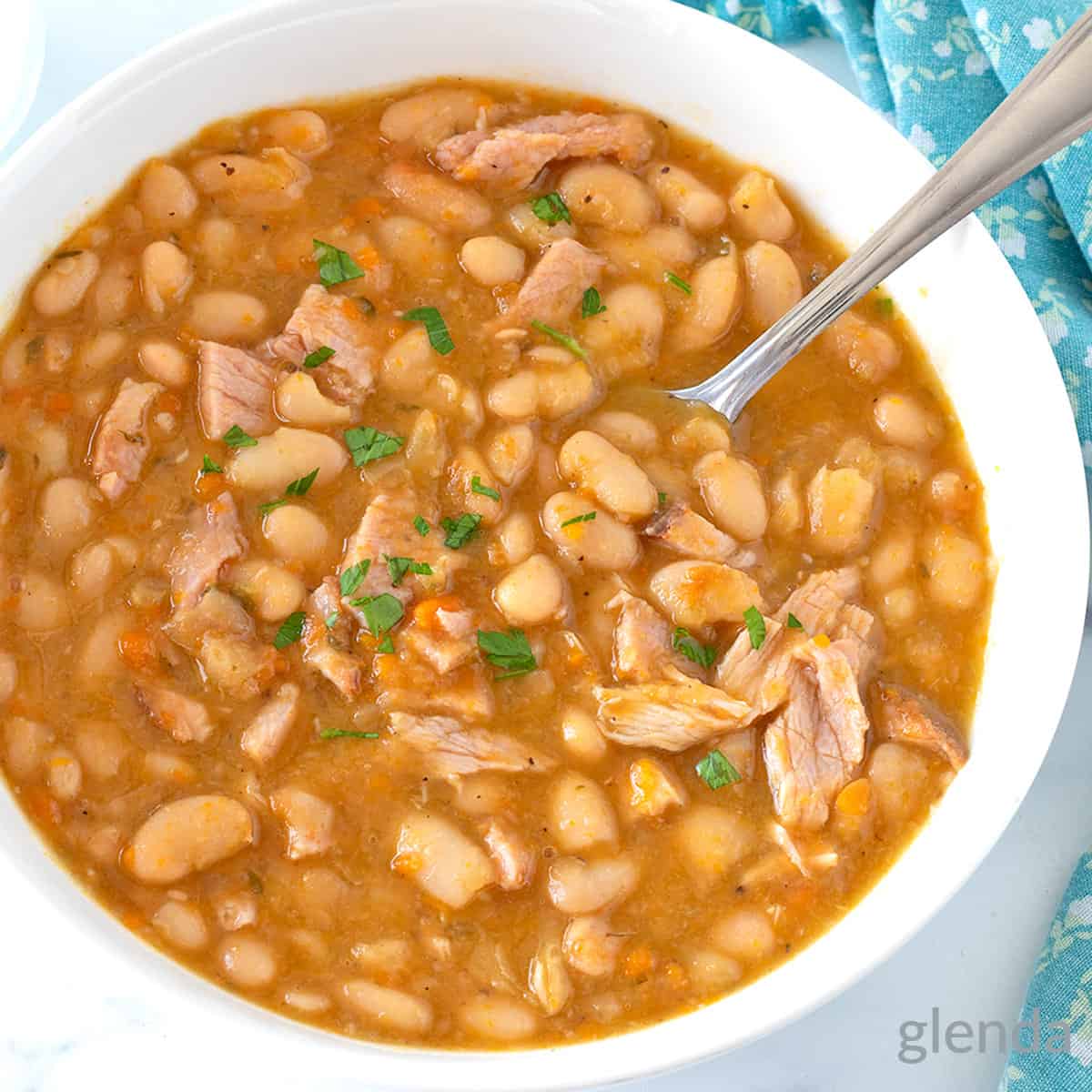 Ham and Beans Recipe served in a white bowl.