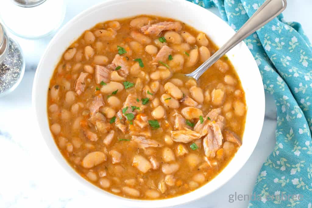 Ham and Beans recipe in a white bowl.