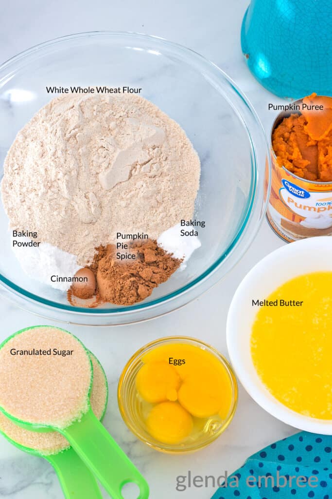 Ingredients for Pumpkin Bars: white whole wheat flour, baking powder, baking soda, pumpkin spice, cinnamon, canned pumpkin puree, granulated sugar, eggs and melted butter.