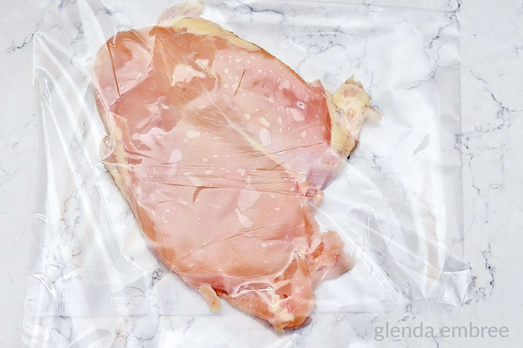 Chicken breast in a zip-top bag to be pounded out thinly.