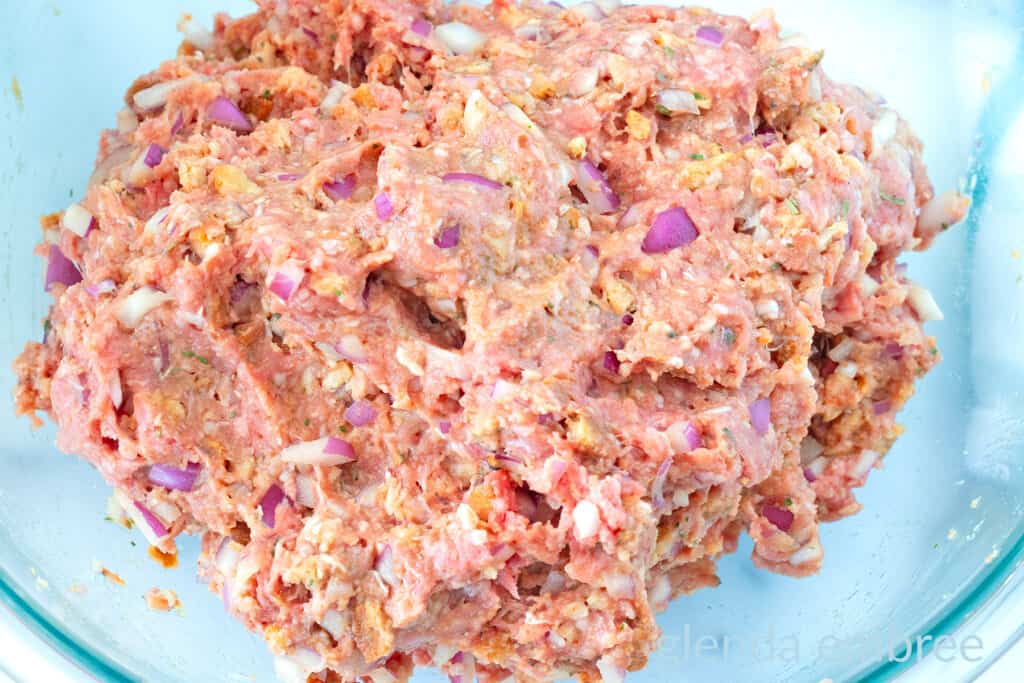 Stove Top Stuffing Meatloaf (Slow Cooker Meatloaf) mixture in a clear bowl.