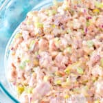 Old Fashioned ham Salad (Deviled Ham) in a clear glass mixing bowl .