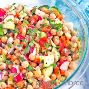Best Easy Chickpea Salad in a clear glass serving bowl.