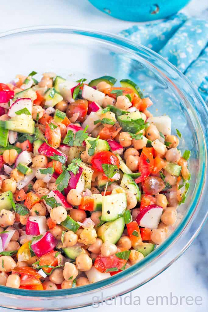 Best Easy Chickpea Salad in a clear glass serving bowl.