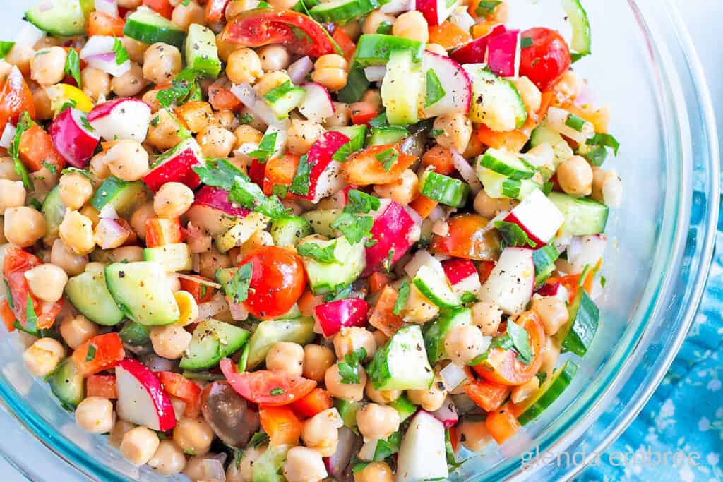 Best Easy Chickpea Salad in a clear glass serving bowl.