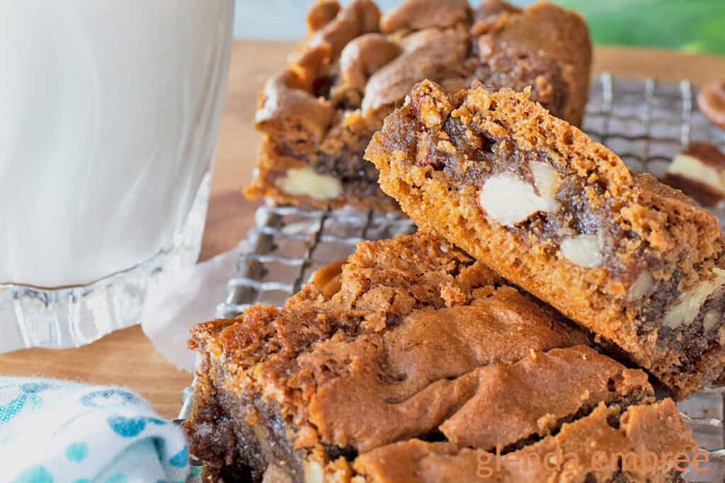 Chewy Brown Sugar Brownies cut into squares and stacked on a cooling rack.  Great Thanksgiving dessert.