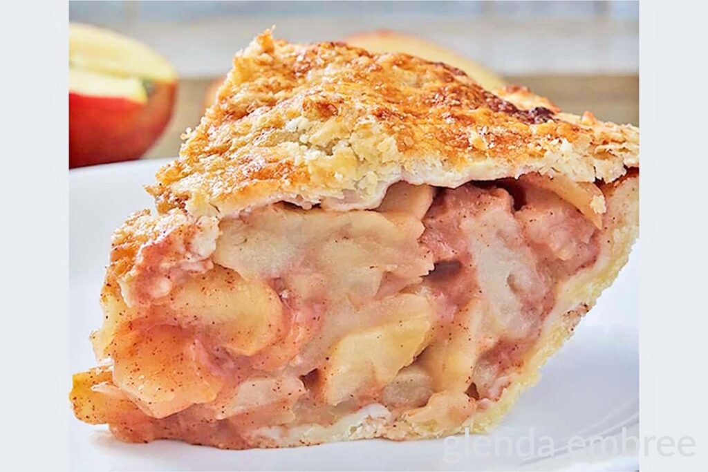 Wedge of Homemade Apple Pie on a white dessert plate.  Fall and Thanksgiving dessert option.