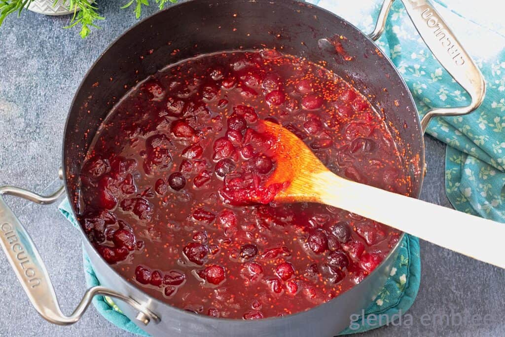 Whole berry cranberry sauce cooked down in a saucepan and left to cool.