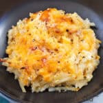 Hashbrown Casserole in a black ceramic bowl.