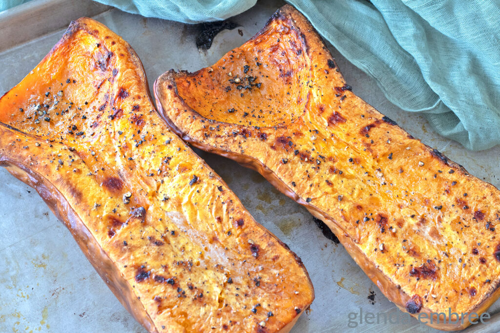 Roasted Butternut Squash halves on a baking sheet.