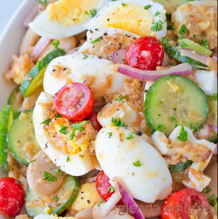 Healthy Egg Salad without mayo in an oval-shaped white ceramic serving bowl.