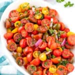 Easy Tomato Salad in a white oval serving bowl.