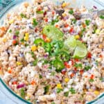 Street Corn Pasta Salad in a clear glass mixing bowl.