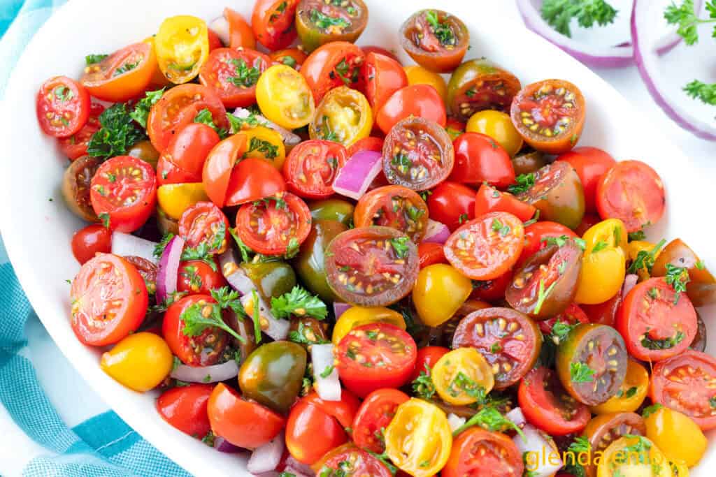 Easy Tomato Salad in a white oval serving bowl.