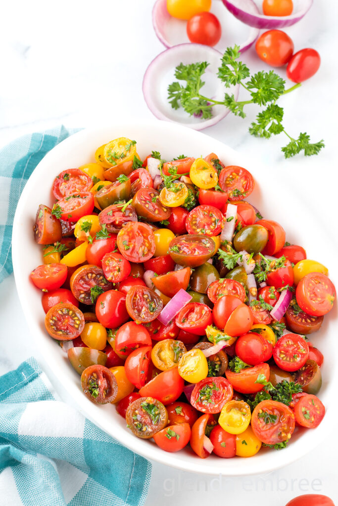Easy Tomato Salad in a white oval serving bowl.