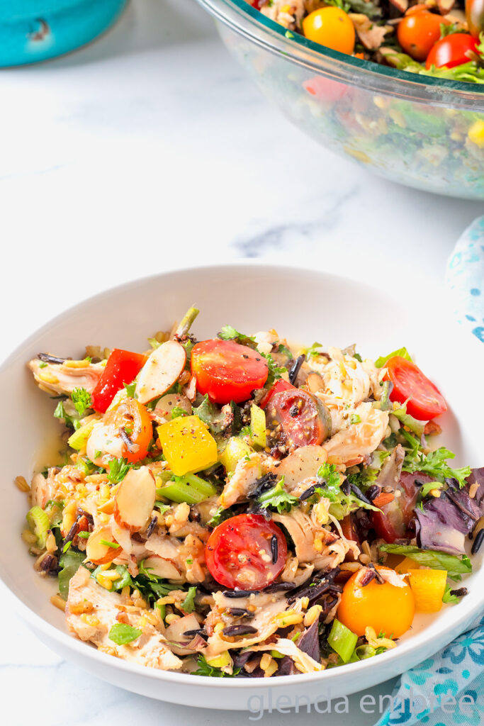 Chicken and Rice Salad in a white ceramic bowl.