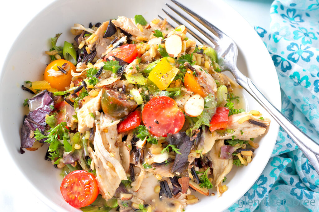 Chicken and Rice Salad in a white ceramic bowl.