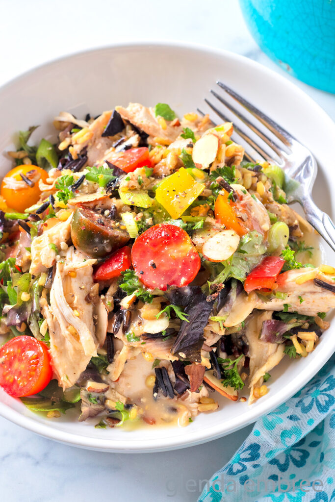 Chicken and Rice Salad in a white ceramic bowl.
