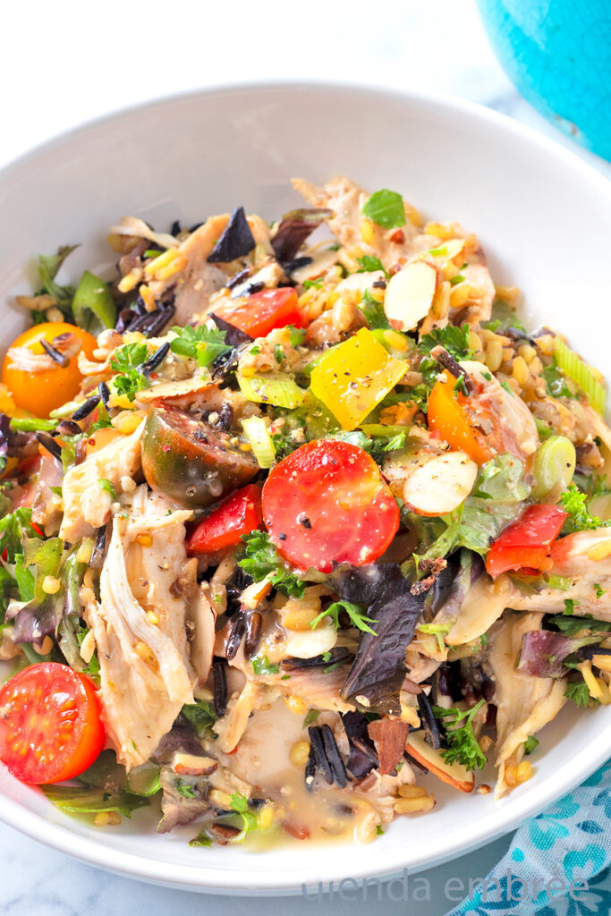 Chicken and Rice Salad in a white ceramic bowl.