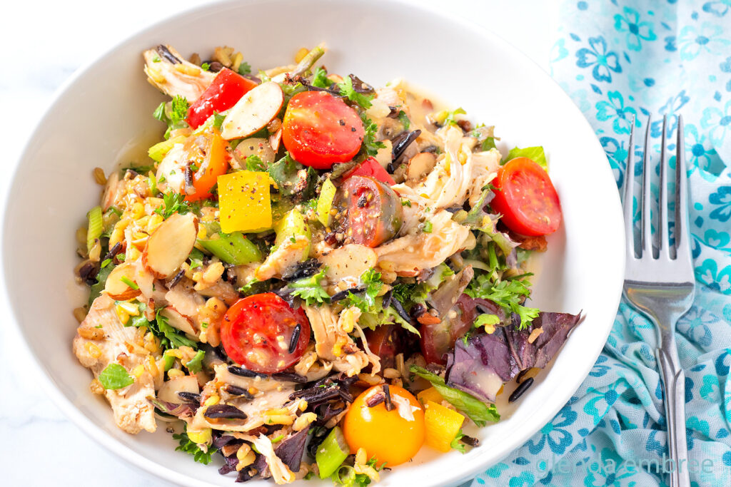 Chicken and Rice Salad in a white ceramic bowl.