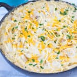 Baked Chicken Tetrazzini in an enameled cast iron skillet.