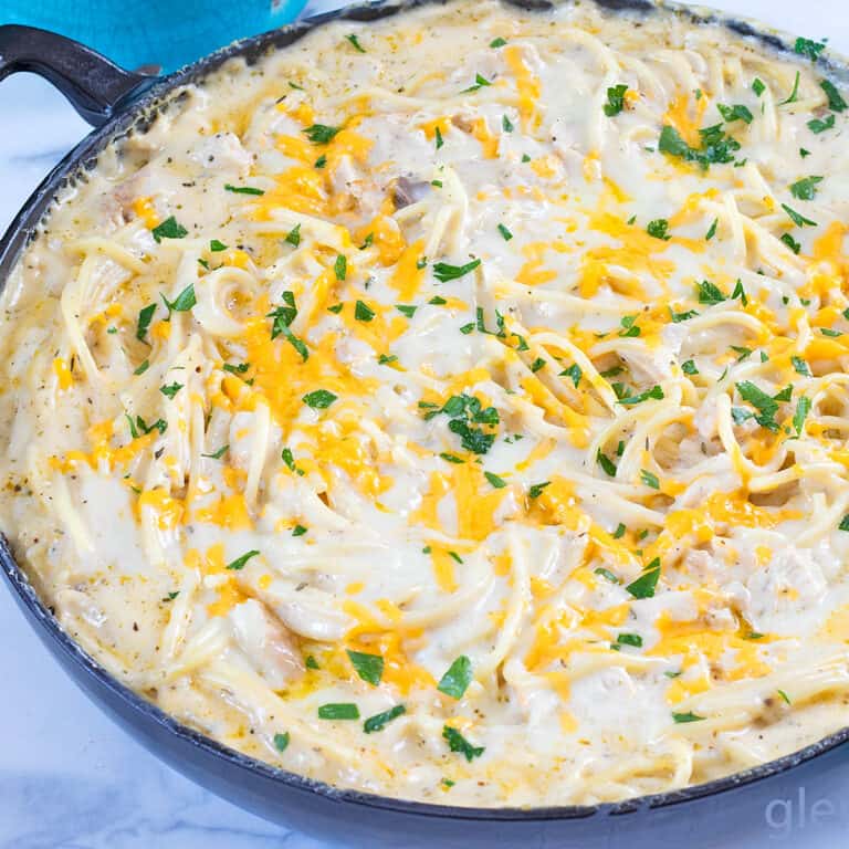 Baked Chicken Tetrazzini in an enameled cast iron skillet.