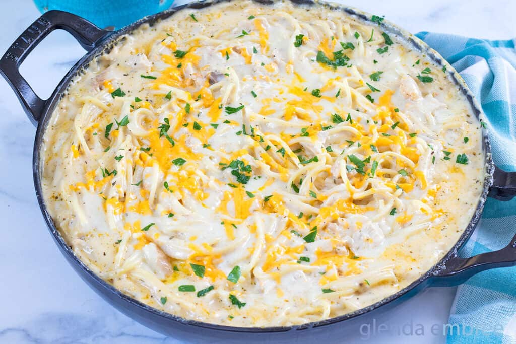Baked Chicken Tetrazzini in an enameled cast iron skillet.