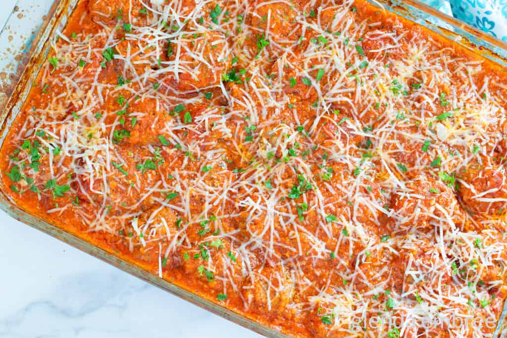 Baked Porcupine Meatballs in a clear glass baking dish.