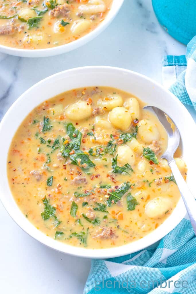 Sausage and Gnocchi Soup in a white ceramic bowl.