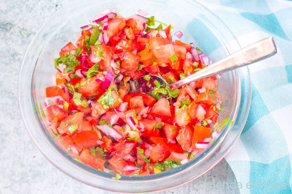 Homemade Pico de Gallo in a clear glass bowl.