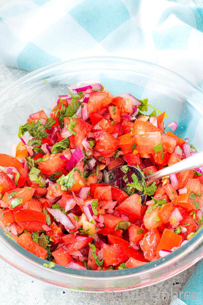 Homemade Pico de Gallo in a clear glass bowl.