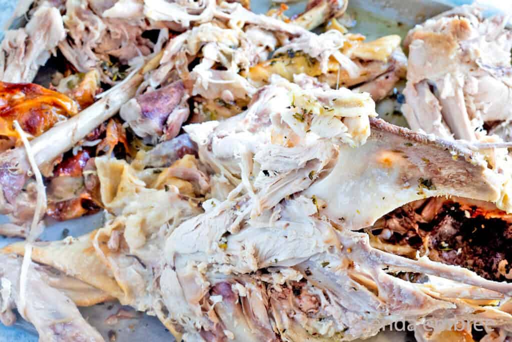 Turkey carcass on a baking sheet.