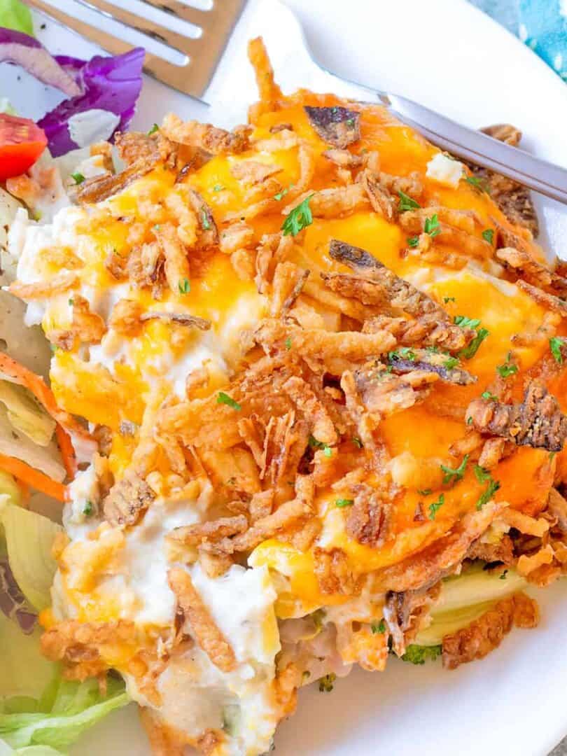 Chicken Casserole (Chicken Broccoli Cheese Casserole) on a white plate with House Salad.