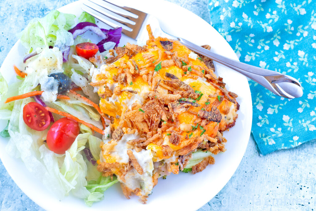 Chicken Casserole (Chicken Broccoli Cheese Casserole) on a white plate with House Salad.