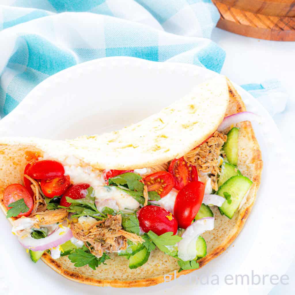 Cheats Pork Souvlaki Wrap on a white plate.