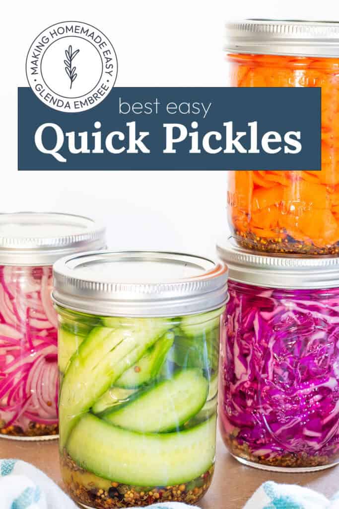 Quick Pickles in mason jars—Quick pickled red onions, quick pickled cucumbers, quick pickled carrots and quick pickled cabbage.