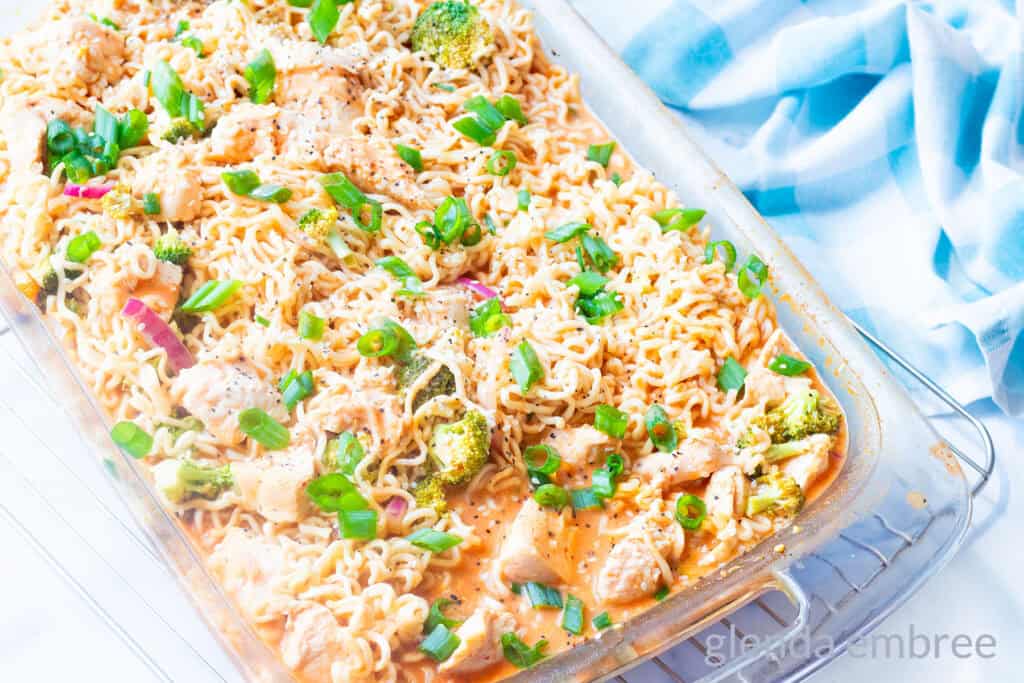 Spicy Chicken Ramen Noodles (Curry Ramen) in a clear glass baking dish.